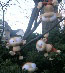 more plush toy monkeys playing in a tree