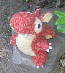 red plush baby dragon (bird's eye view)